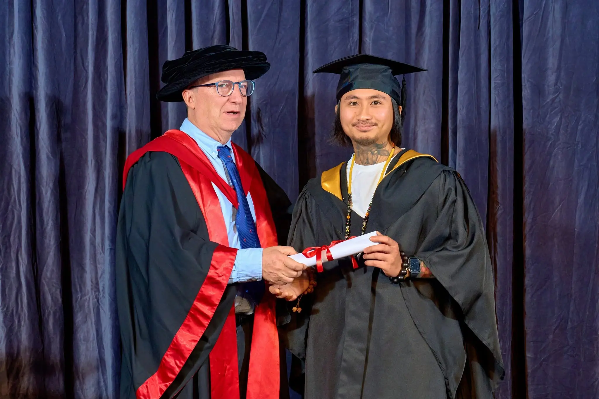 IHM alumni portrait during graduation ceremony
